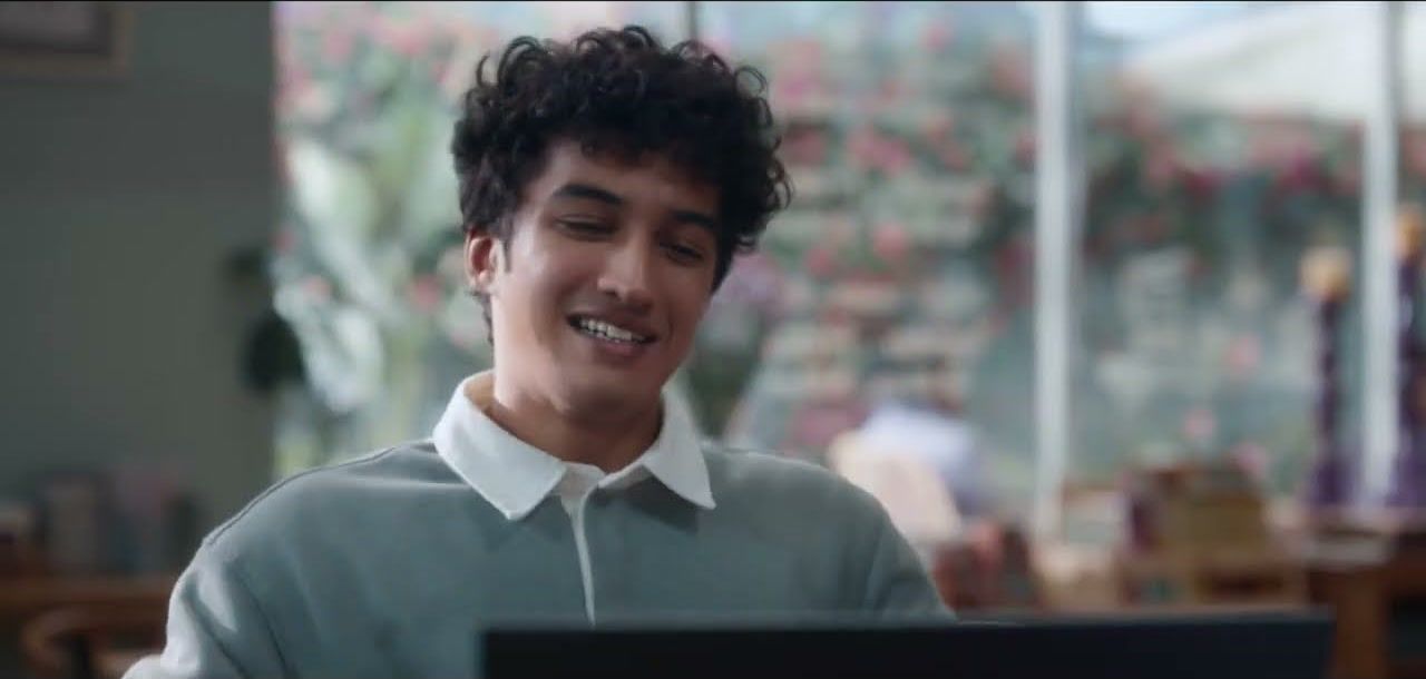 A student in a warm-lit room, from Dell’s Lamps spot