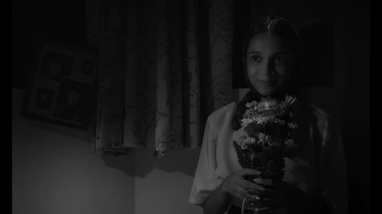 A girl holding flowers, from the Applechedikal trailer